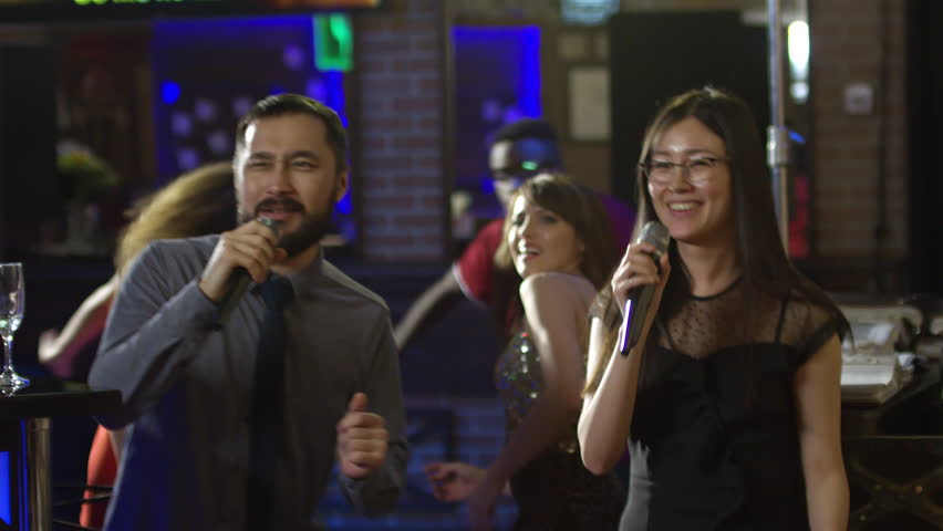 two asian girls singing Two asian girls singing